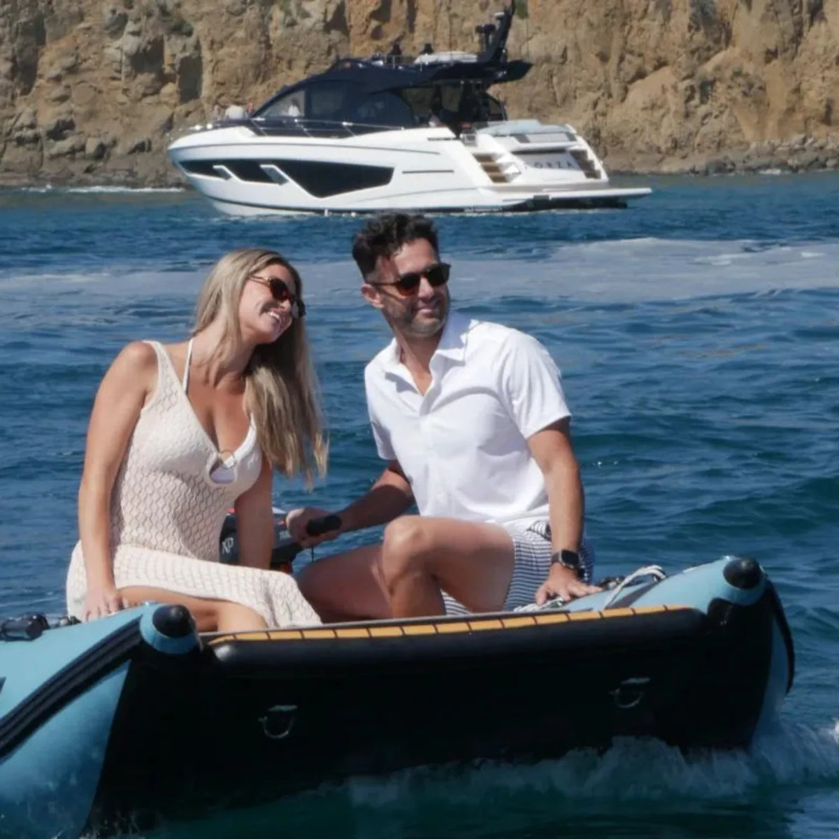 Battle Cat inflatable catamaran used as a yacht tender with a couple aboard