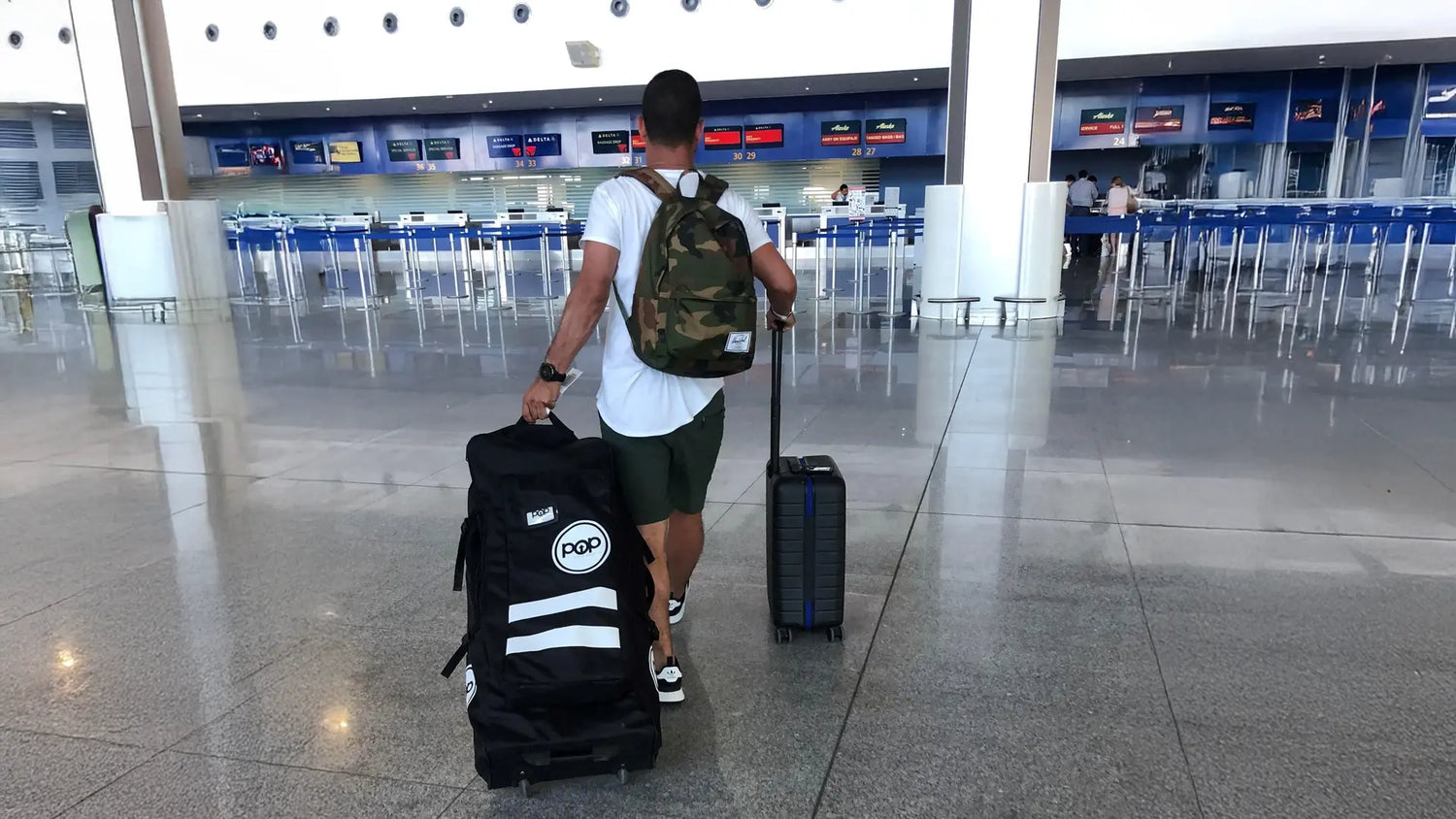 Inflatable paddleboard packed in travel bag at airport ready for Lake Tahoe adventure