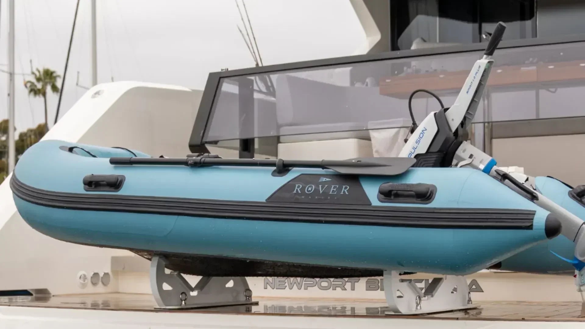 Rover Marine inflatable boat mounted on a yacht swim platform with electric outboard.