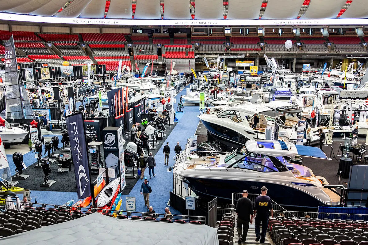 Canadian Board Co team at Vancouver Boat Show Booth 441 with Rover Marine inflatable boats.