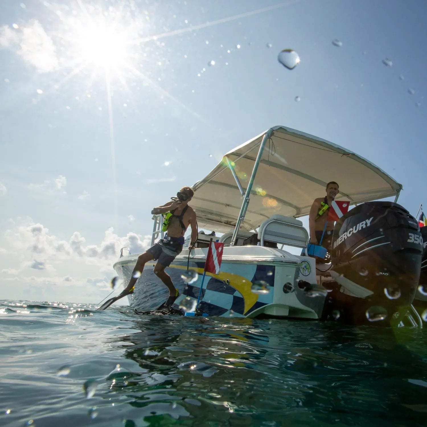 Divers using the DiveBlu3 Nomad tankless system while snorkeling on the water surface.
