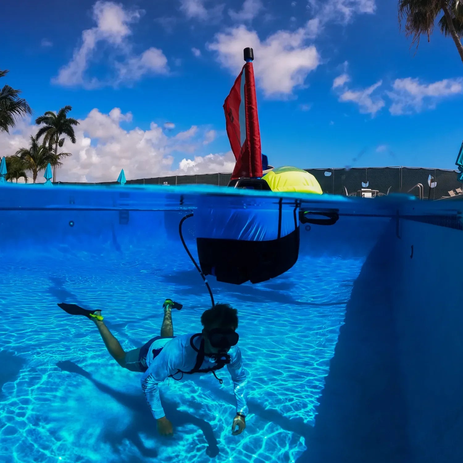 Divers training with the DiveBlu3 Nomad tankless dive system in a swimming pool.