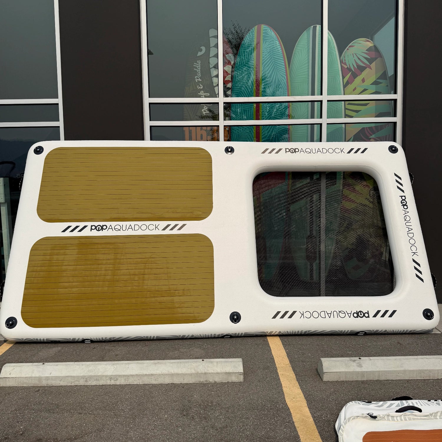 Green Program POPUP AQUADOCK 14x7 inflatable floating platform showcasing traction fading and minor glue leaking.