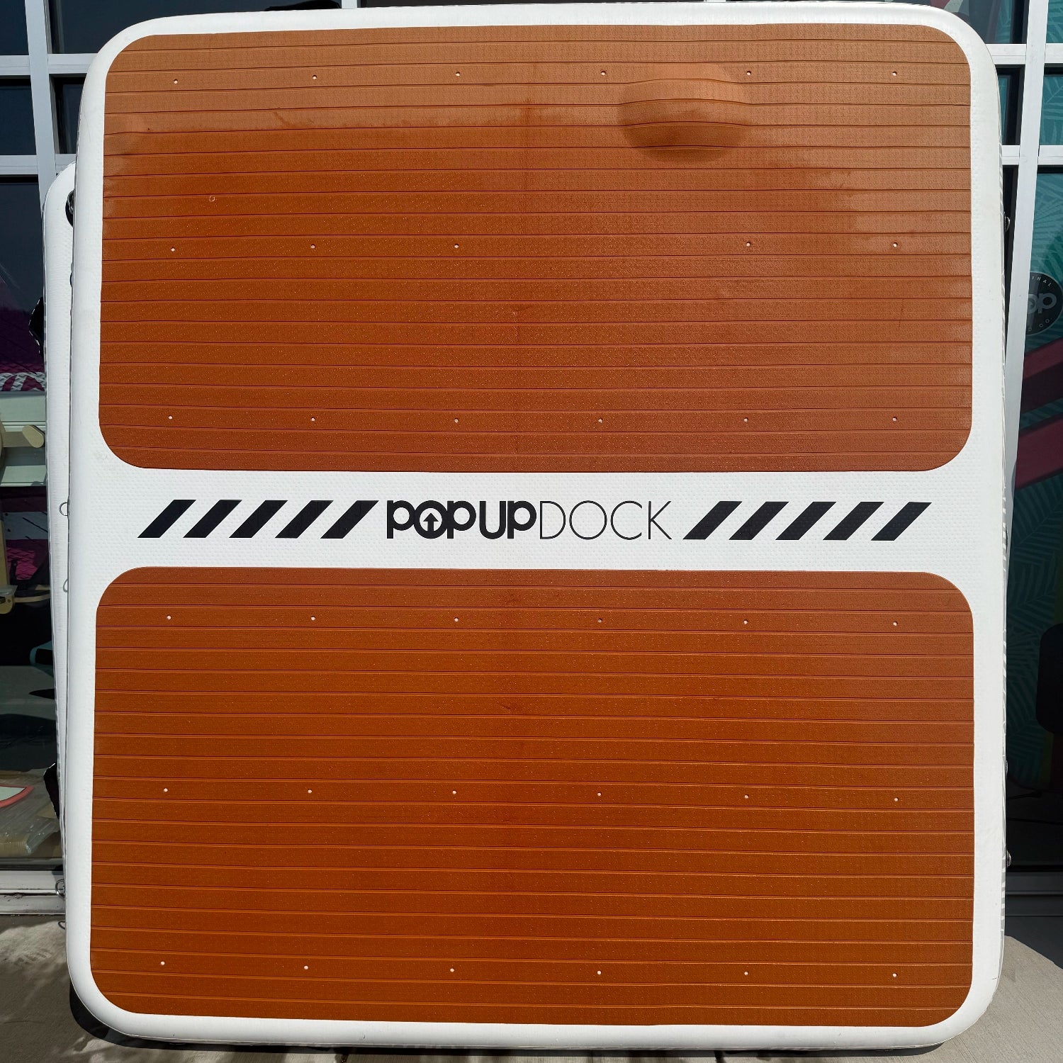 Green Program POPUP DOCK 8x7 inflatable floating platform showcasing EVA traction bubbling and 1 missing D-ring.