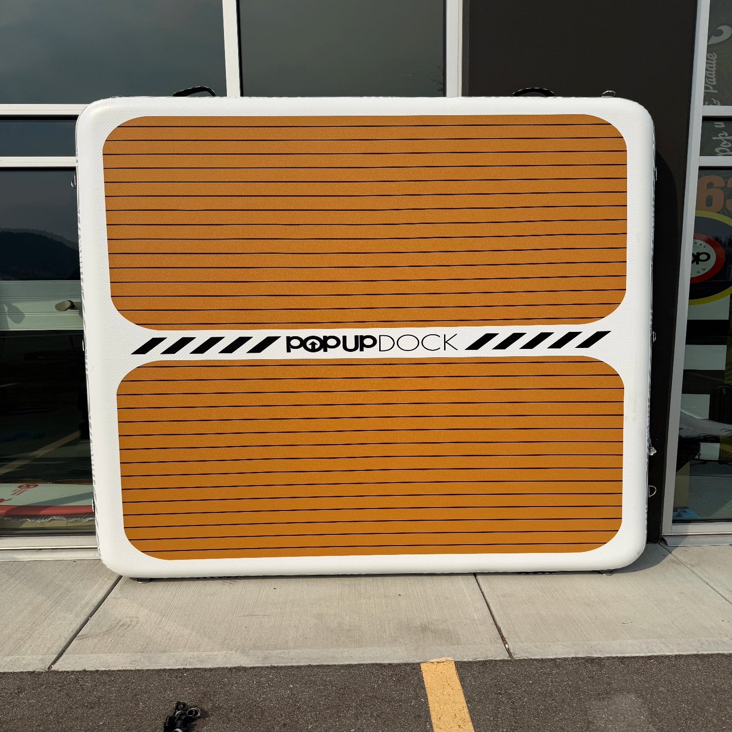 Green Program POPUP DOCK 8x7 inflatable floating platform featuring a professional patch.