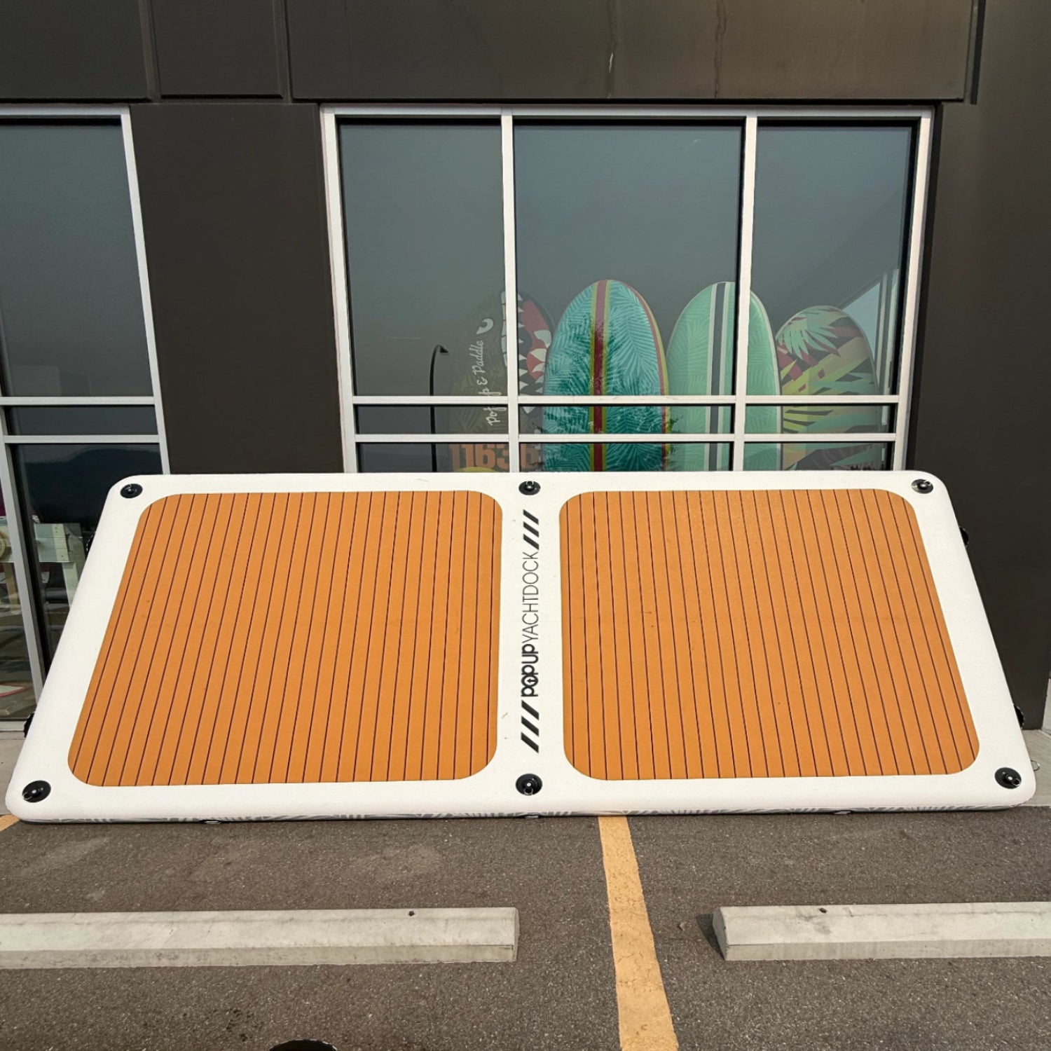 Green Program POPUP YachtDock 14x7 inflatable floating platform showcasing 2 missing D-rings and minor surface dirt.