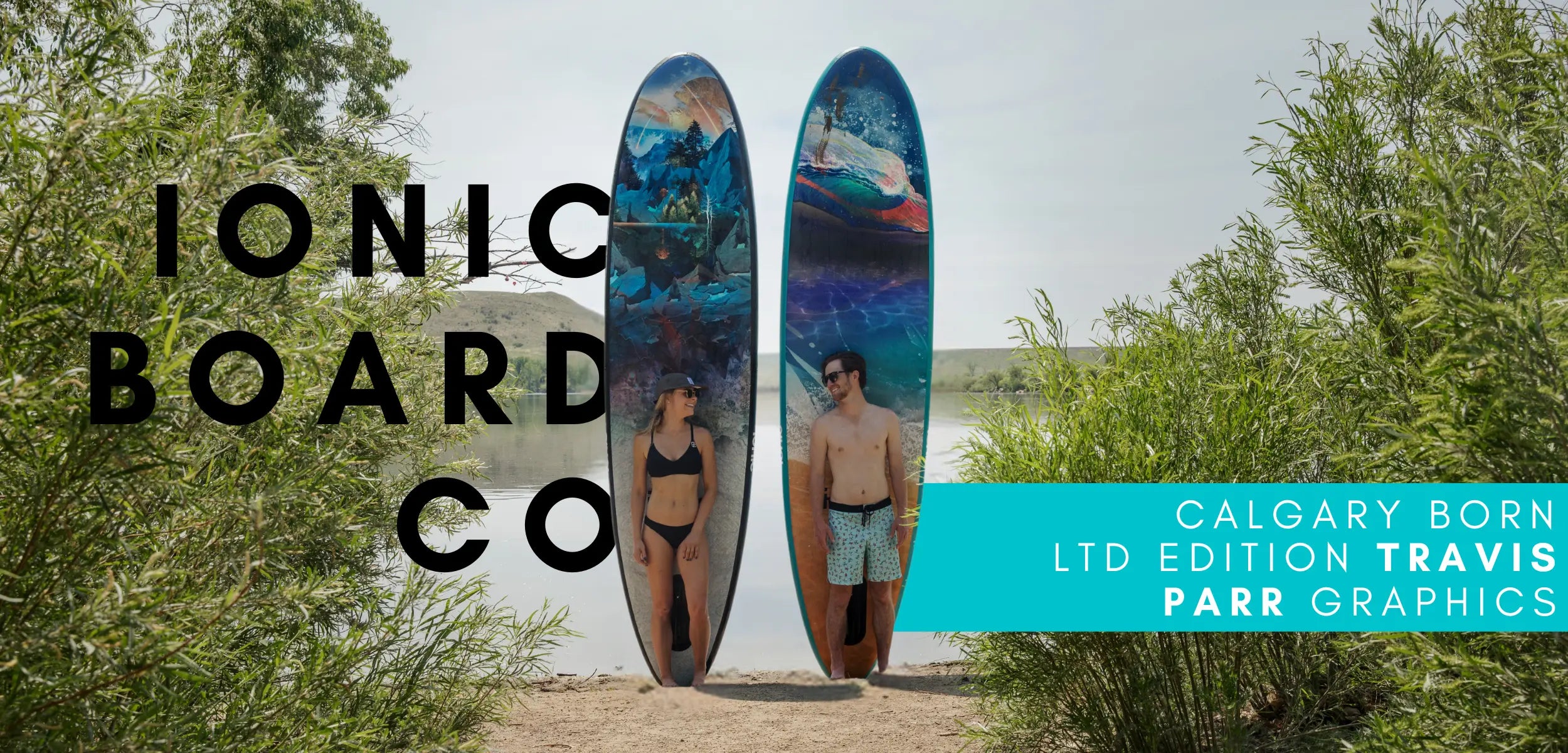 Board Co limited edition paddleboards featuring Calgary-born artist Travis Parr graphics, showcased by two people standing with boards near a lake.