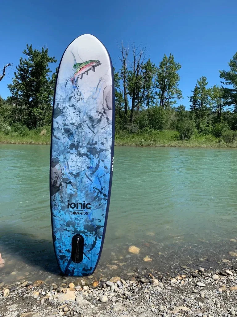 Hook ‘Em Edition Ionic paddleboard on calm lake water.