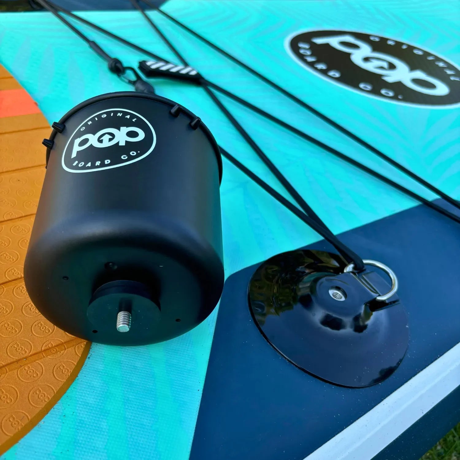 POP universal drink holder holding beverages on paddleboard.