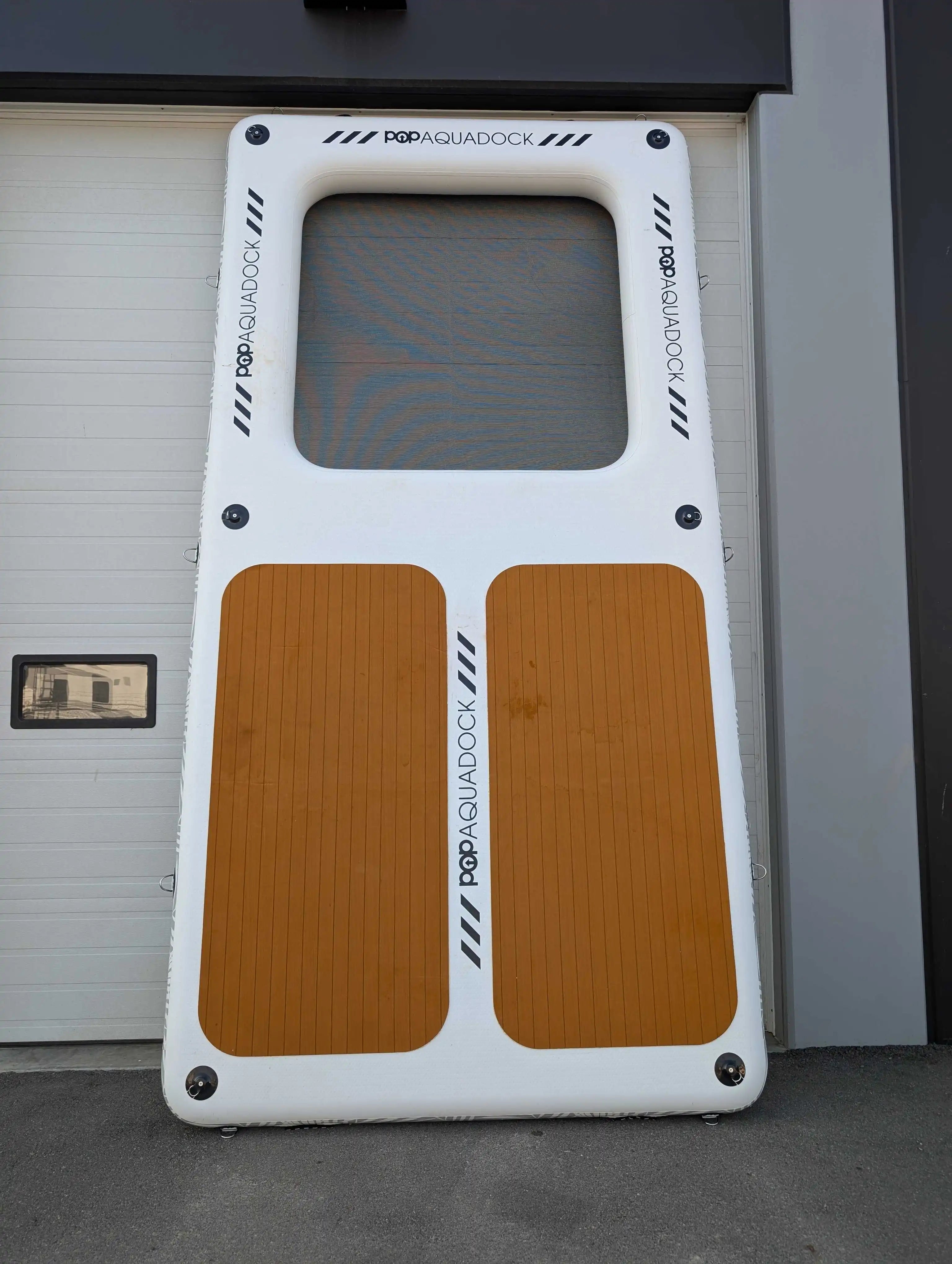 POP Up Aqua Dock 14x7 inflatable water dock with dual non-slip traction pads and mesh center.