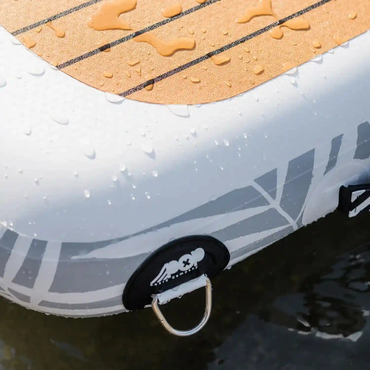 Close-up of POP AquaDock non-slip teak-style PVC traction pad with water droplets.