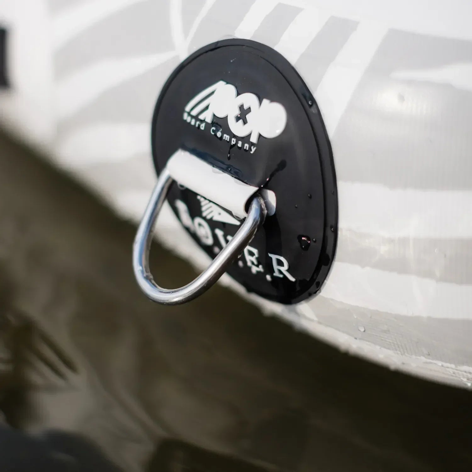 Close-up of the POPUP Dock inflatable platform anchor point with sturdy D-ring for secure mooring and attachment.