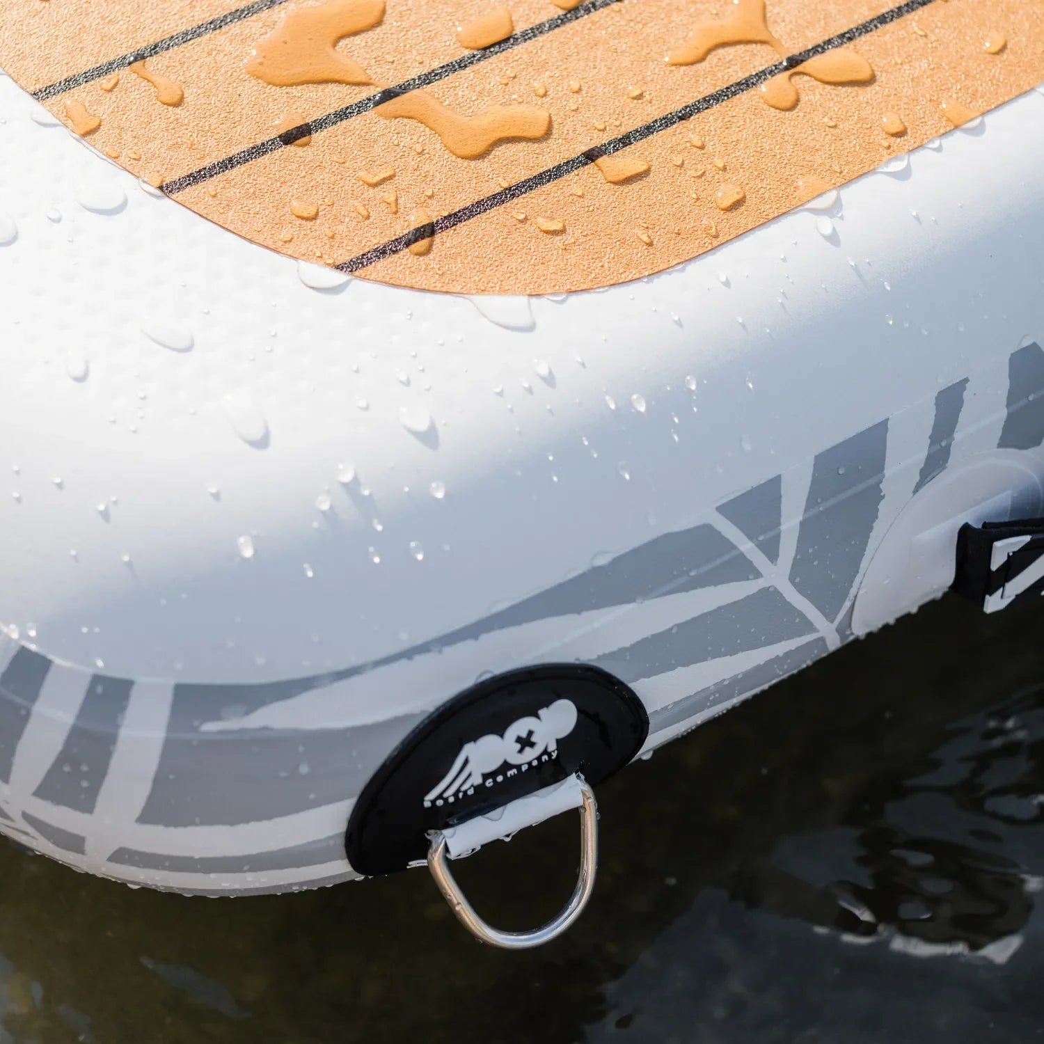 Close-up of the POPUP Dock corner showing the premium non-slip PVC traction pad with water droplets and a durable anchor D-ring attachment.