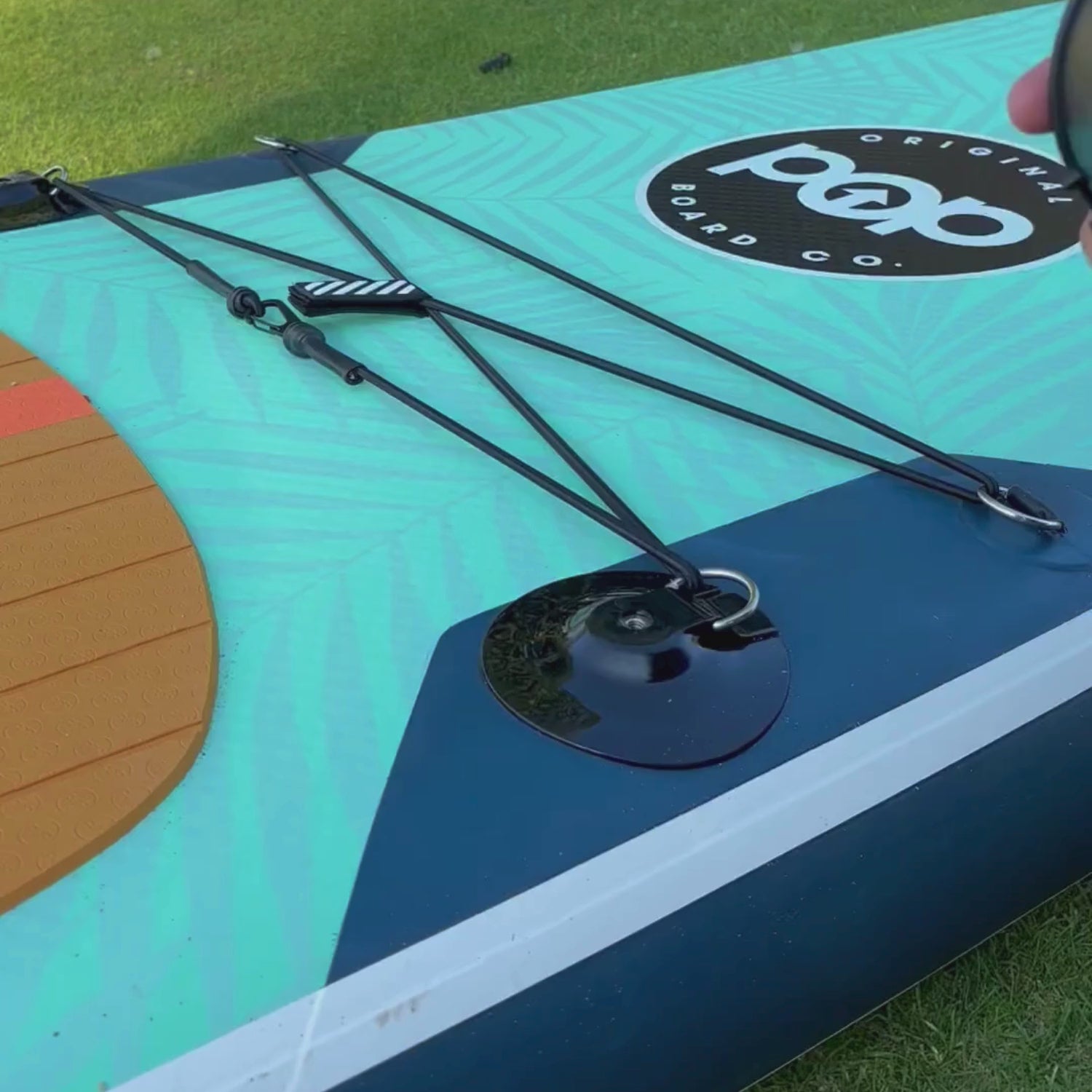 POP paddleboard cup holder being installed securely on SUP.