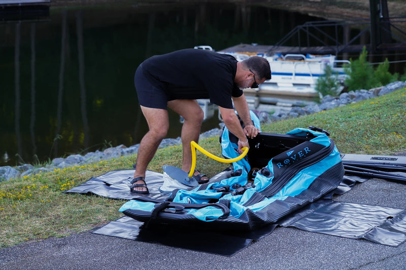 Pumping up the Rover Marine Battle Boat with the hand pump on shore