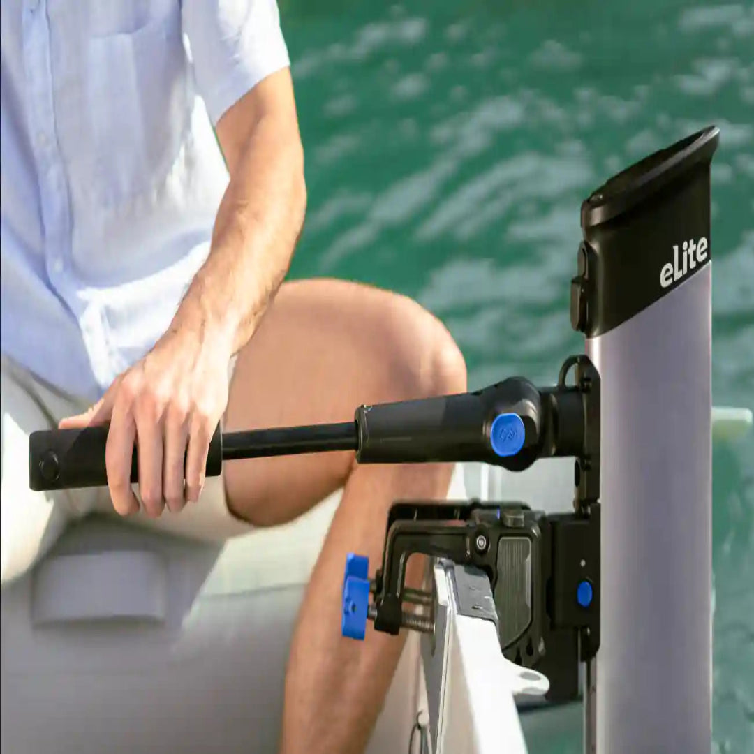 Person using a  electric motor machine with a visible brand logo on a boat.