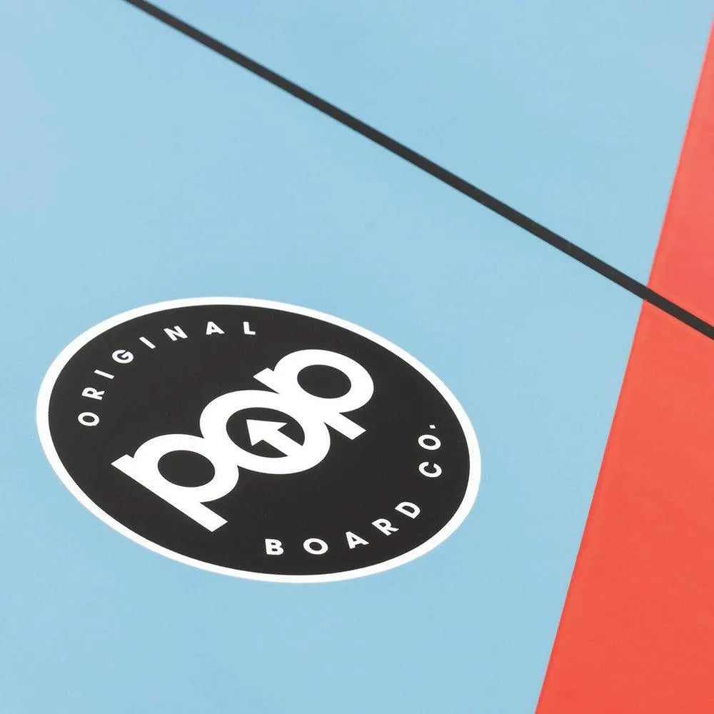 POP Board Co. logo detail on the Battle Fish Surfboard in blue with red racing stripe design.