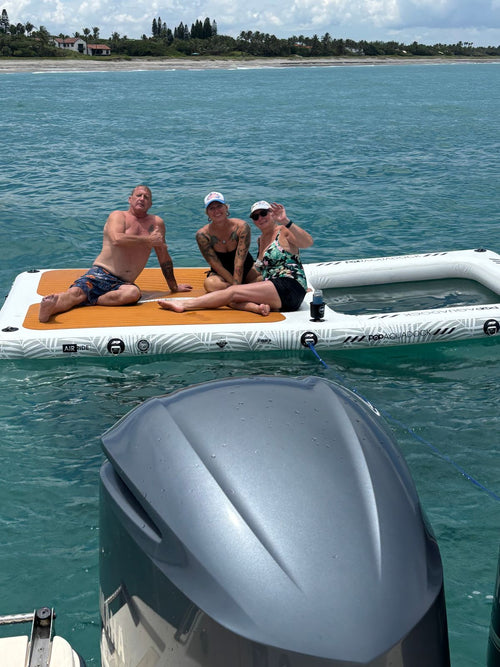 Friends on the AquaDock on turquoise water