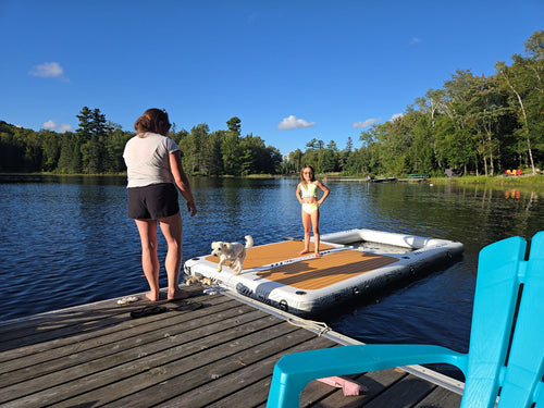AquaDock tied off a cottage dock on a forested lake