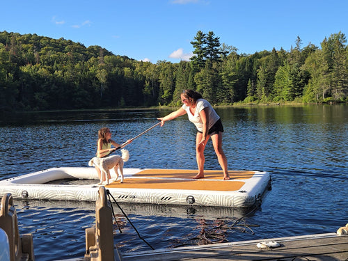 Owner and daughter with their dog on the AquaDock