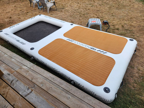 AquaDock inflated on a sandy beach