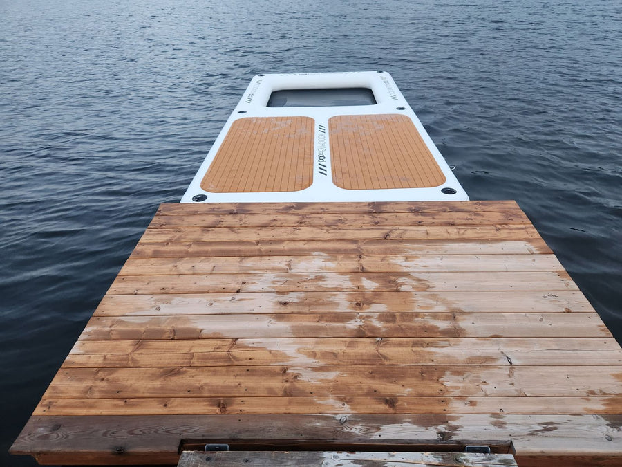 AquaDock connected to the end of a floating wooden dock