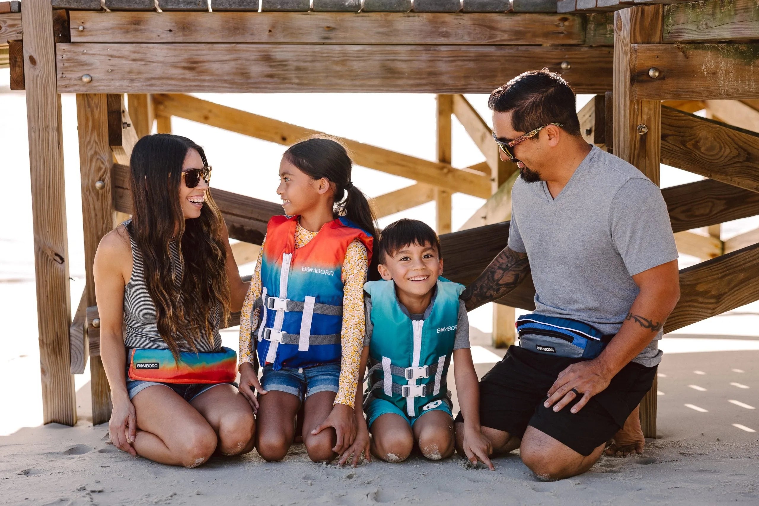 Family enjoying outdoor water activities with the Super Belt inflatable PFD from Canadian Board Co.