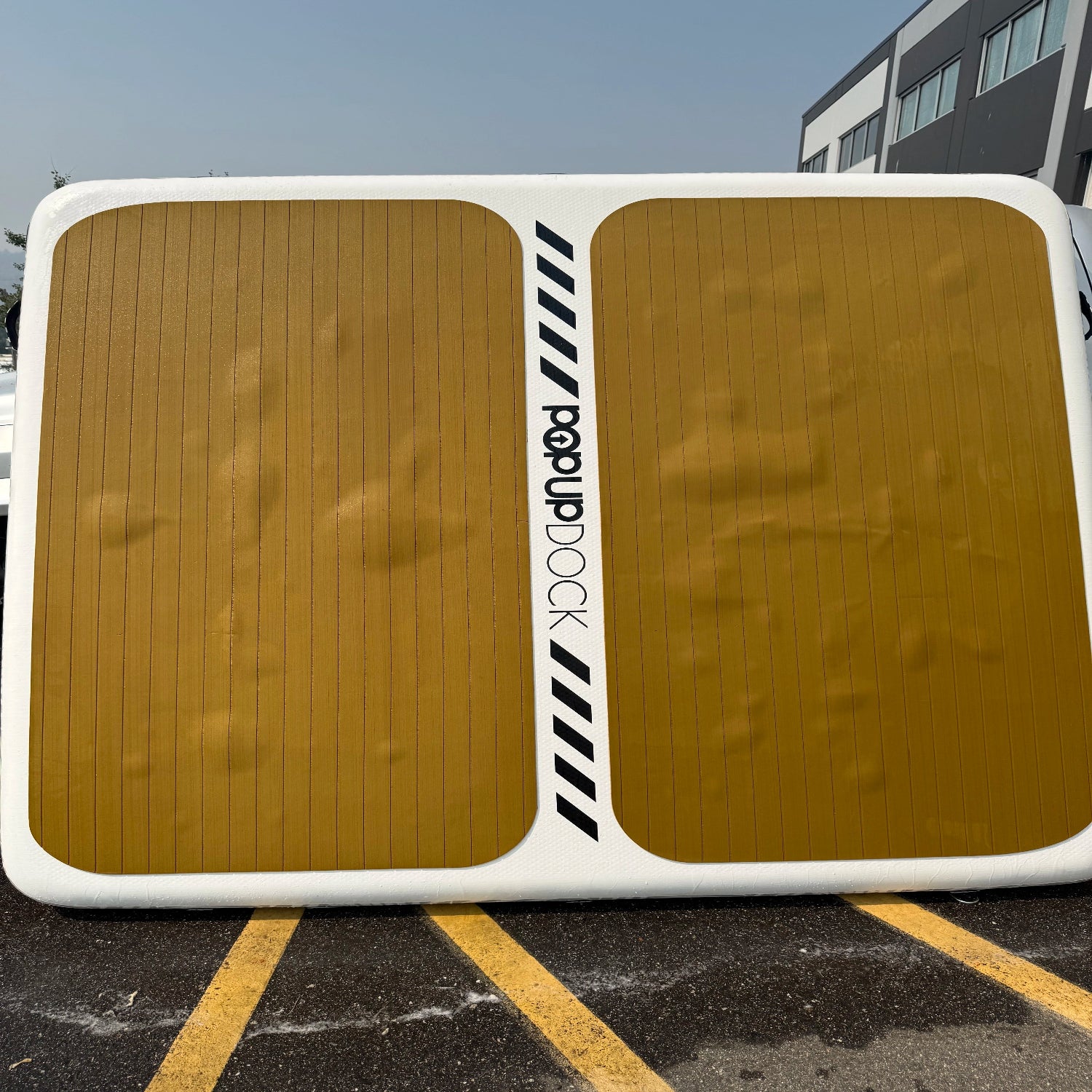 Green Program POPUP DOCK 8x7 inflatable floating platform showing minor cosmetic traction pad bubbling and surface fading.