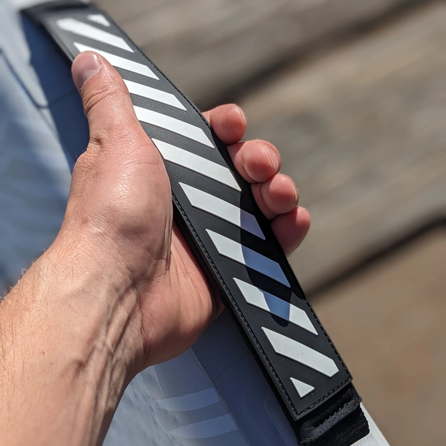 Close-up of reinforced handle on POP Up Chair inflatable seat for easy carrying.