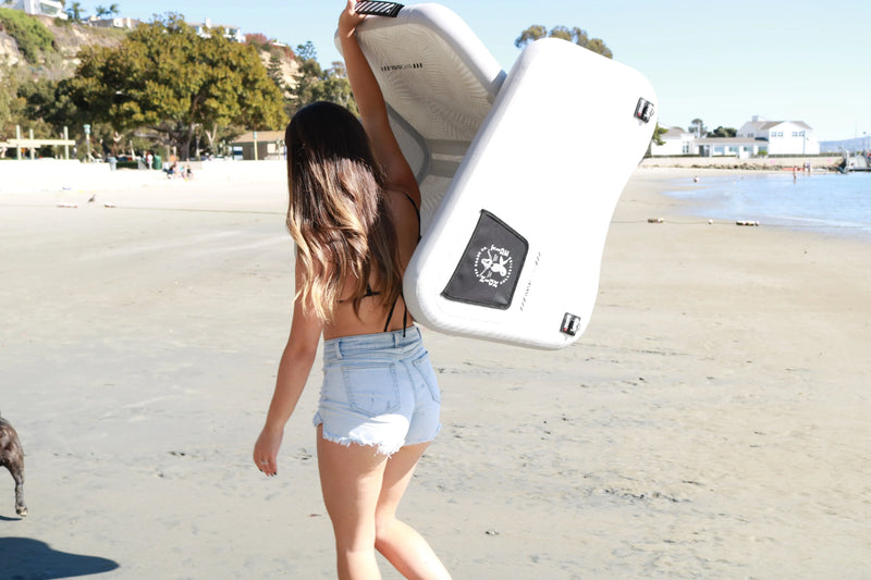 Side view of Inflatable POP Up Chair being carried by hand, highlighting easy transport.