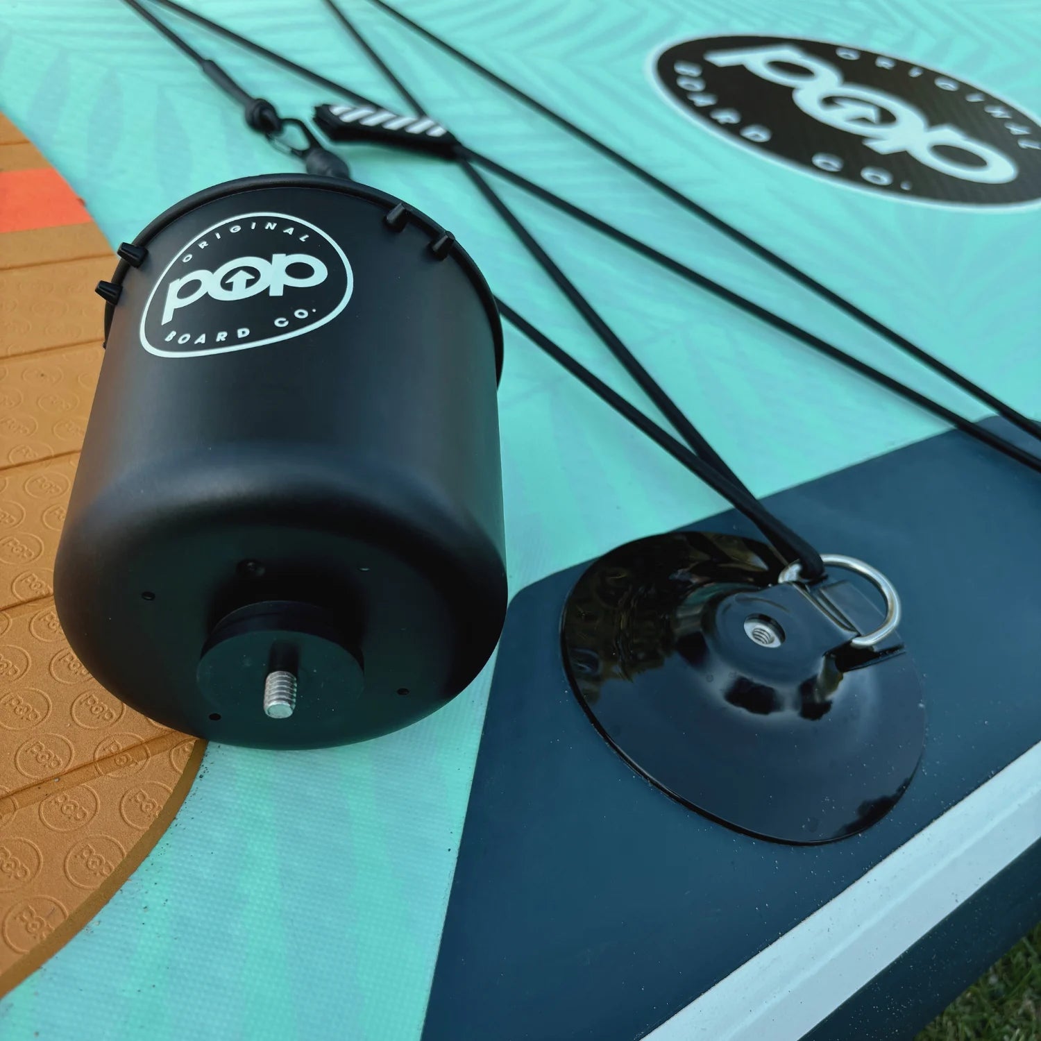 Close-up of POP Yacht Hopper paddleboard cup holder attachment and D-ring for added convenience.