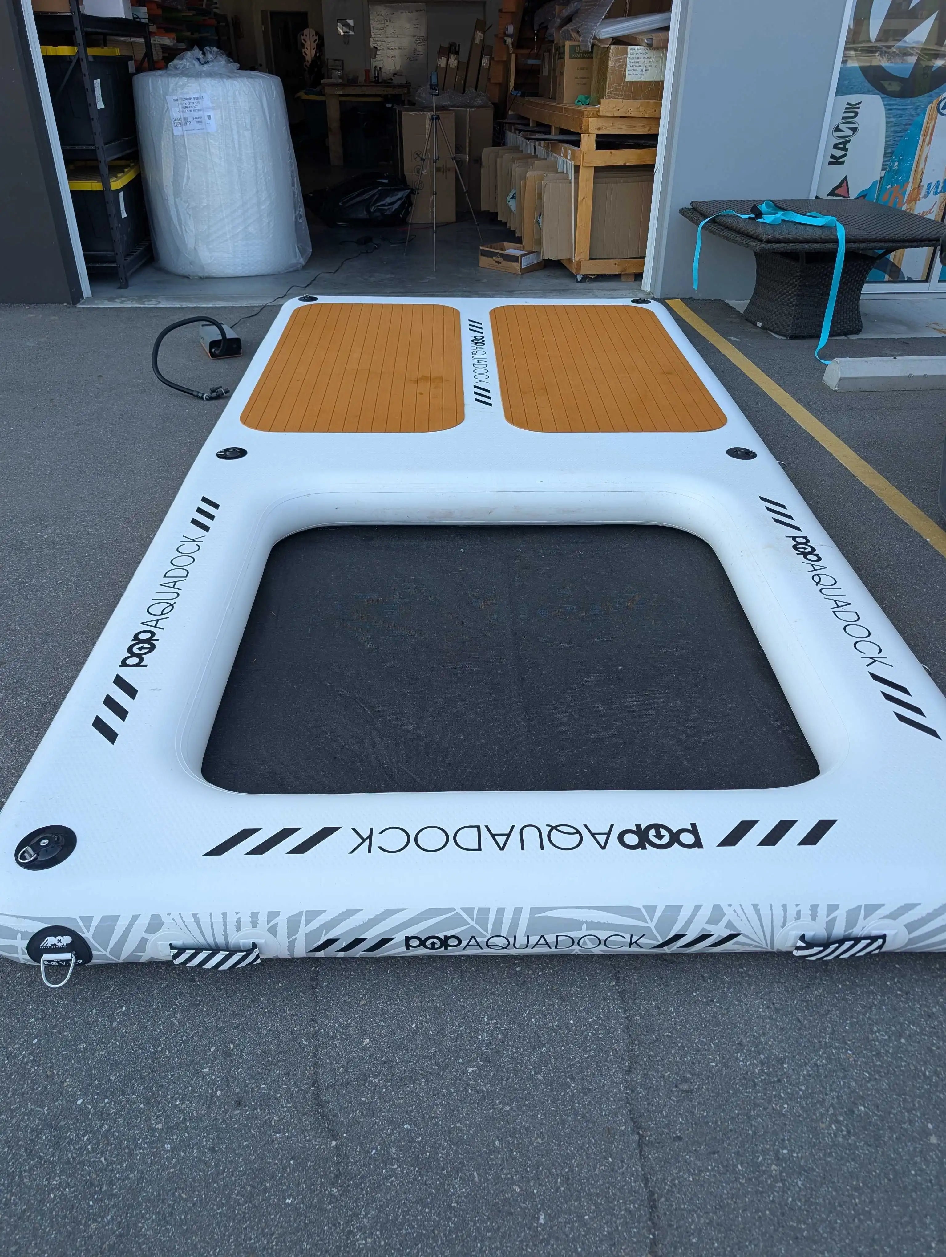 POP Up Aqua Dock 14x7 floating dock with traction pads and mesh hangout section, angled view.