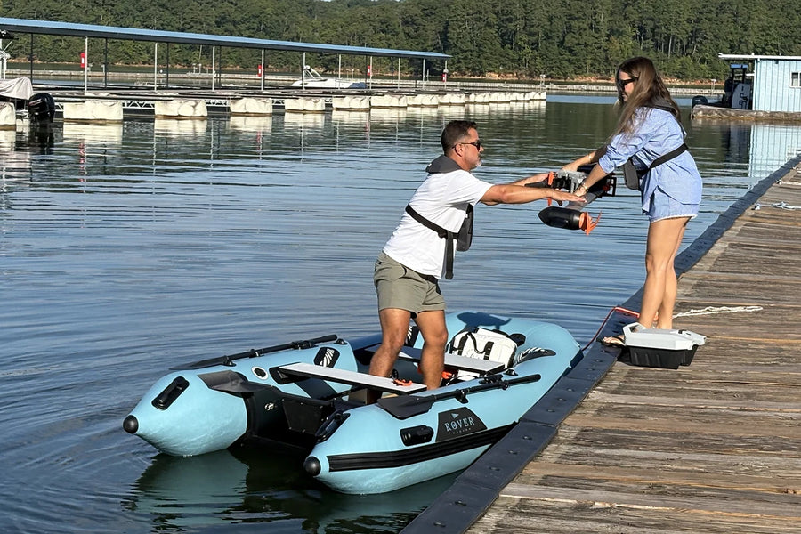 Loading gear from the dock into the 10 ft Rover Marine Battle Boat