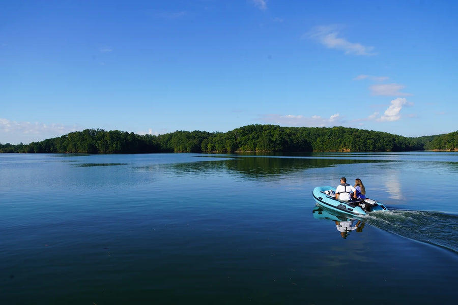 10 ft Rover Marine Battle Boat on a quiet cottage lake with a tree-lined shore