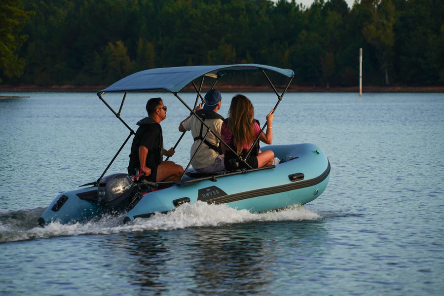 Three friends in the 12 ft Rover Marine Battle Boat under the Bimini, sold separately