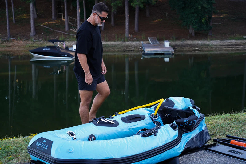 Inflated 8 ft Rover Marine Battle Boat on shore, ready for the motor