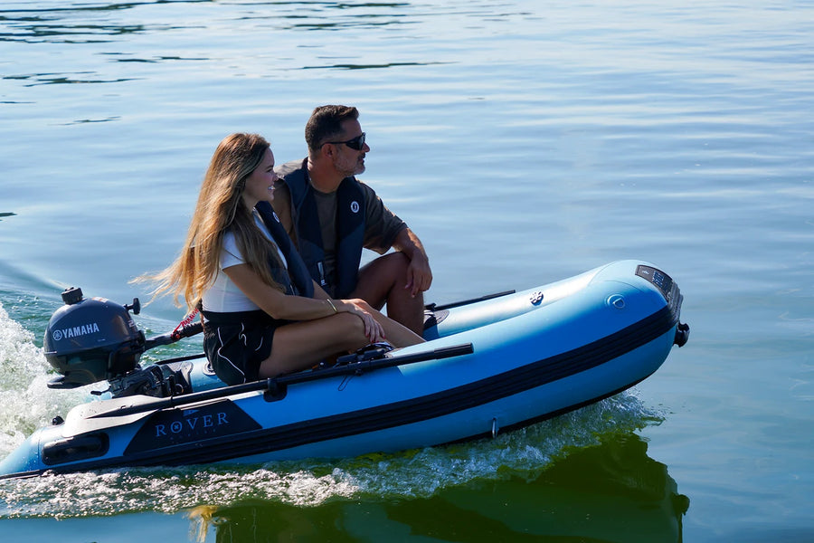 Couple cruising in the 8 ft Rover Marine Battle Boat with a Yamaha outboard