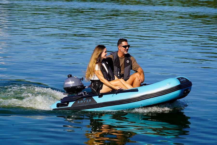 Two people riding the 8 ft Rover Marine Battle Boat inflatable tender on the lake