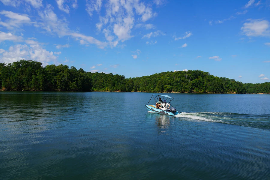 10 ft Rover Marine Battle Cat out on open water with a Bimini top