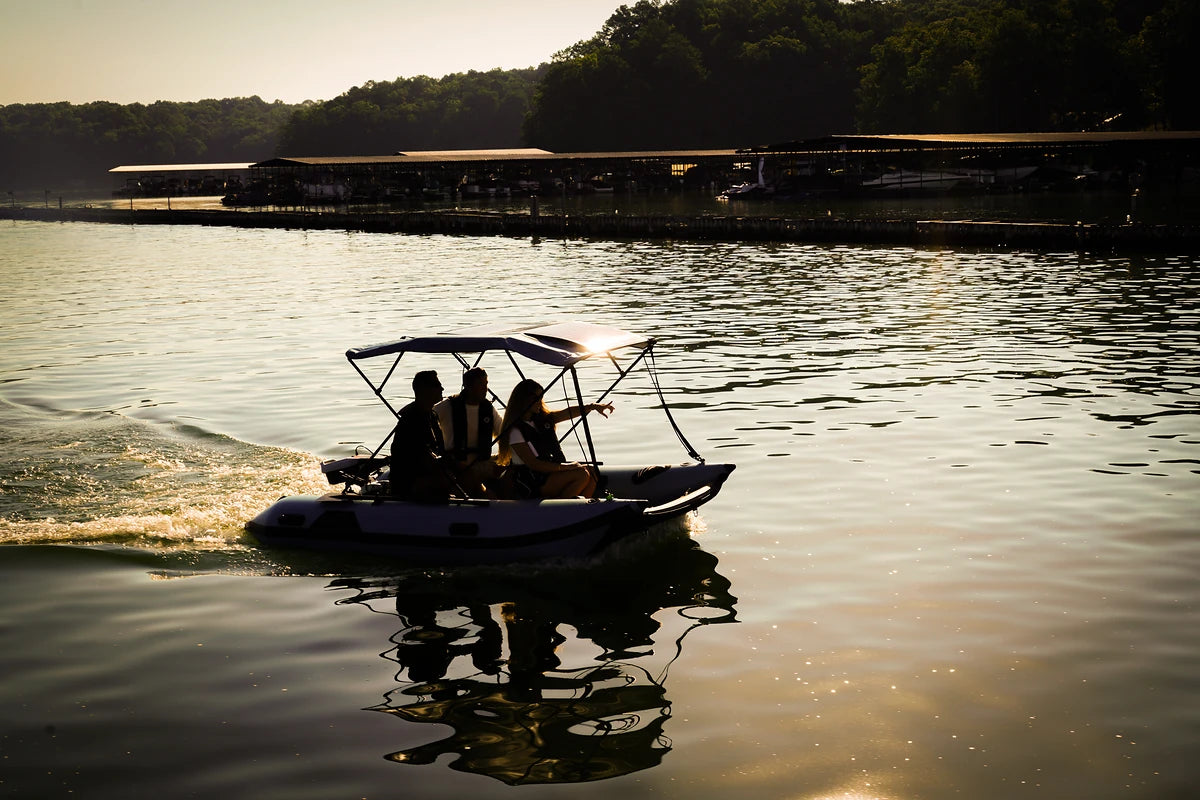 12 ft Rover Marine Battle Cat silhouetted at sunset on the lake