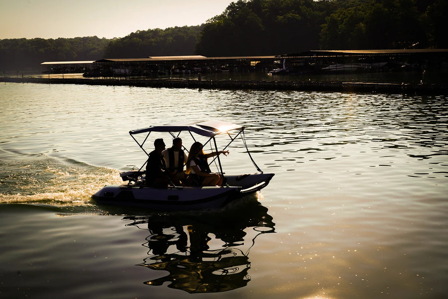 12 ft Rover Marine Battle Cat silhouetted at sunset on the lake