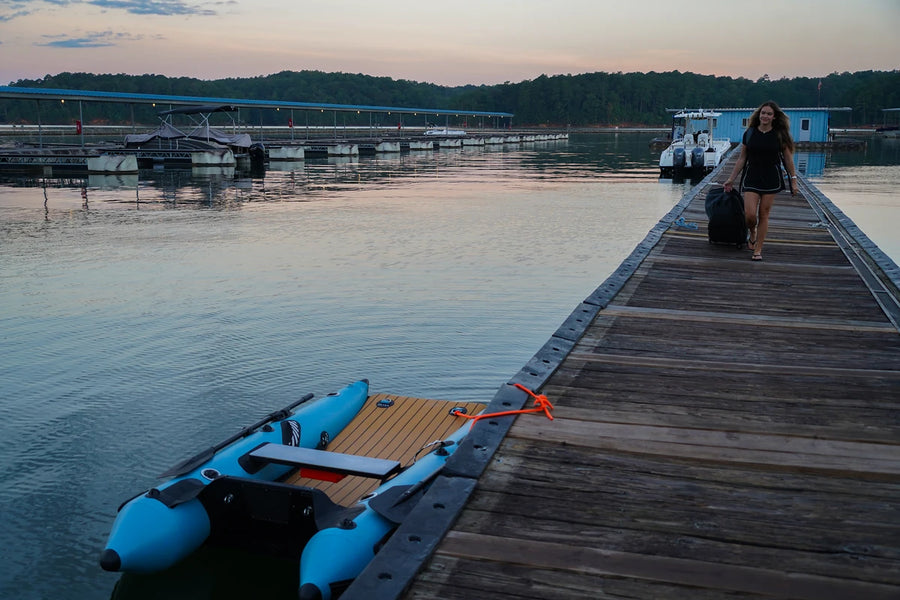 8 ft Rover Marine Battle Cat inflatable catamaran tied at a wooden dock