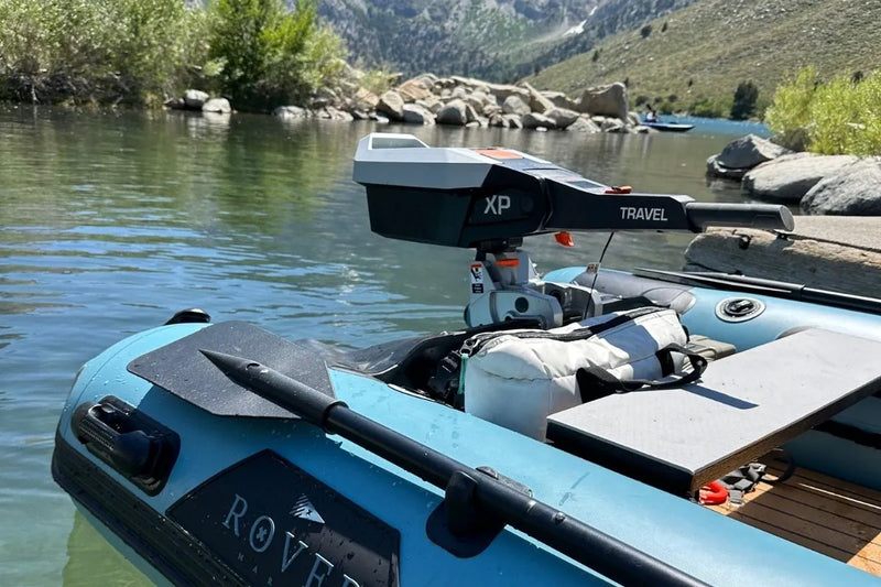 Close-up of Rover Marine inflatable boat with electric motor mounted at stern
